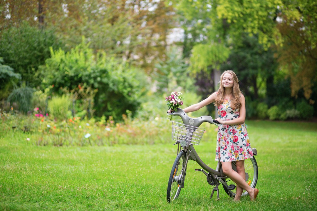 Happy girl with bicycle